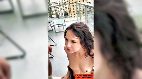 Liz Jordan topless on balcony, seductive pose with wavy brunette hair