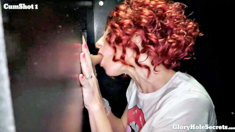 Redhead amateur at gloryhole sucking and licking cum eagerly