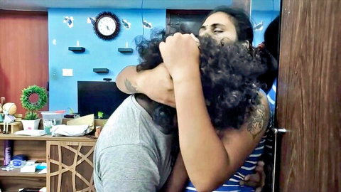 Tattooed Indian woman with curly hair embraces man in homemade adult scene