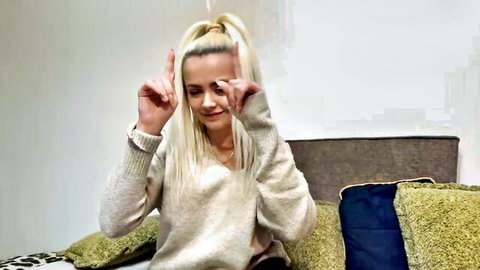 Miarey_1 shy blonde teen in cozy sweater making playful gesture