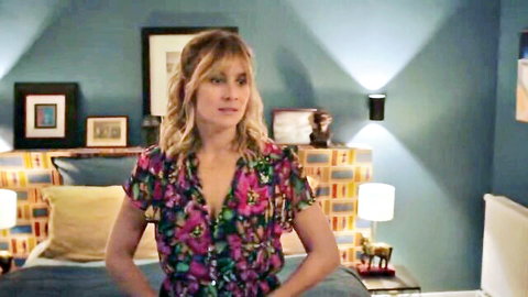 Julie De Bona in sexy floral dress, standing seductively