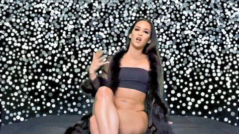 Miss Amina Rose seductive solo pose in black crop top and fur robe