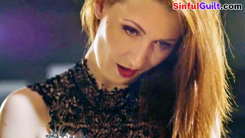Seductive redhead MILF in sheer black lace lingerie teases with sultry gaze and red lips
