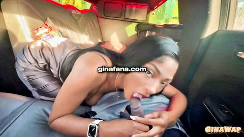 Ebony babe sucking thick blue popsicle like cock in car with tongue out and cleavage