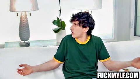 Curly-haired man in green shirt gesturing excitedly in hot MYLF scene