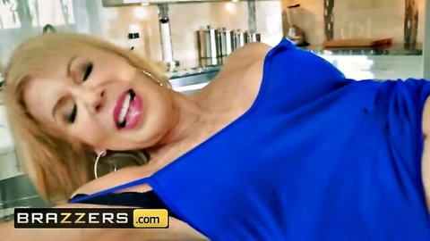 Erica Lauren in sexy blue dress, teasing with cleavage and open mouth