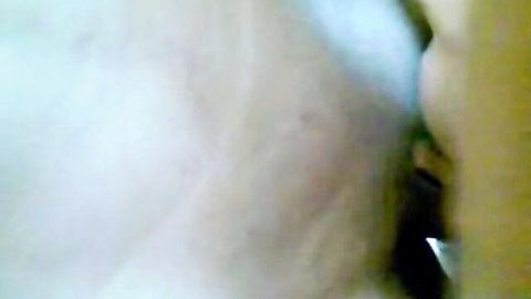 Blurry close-up of passionate wet kiss between two lovers in rough sex