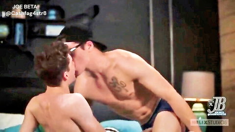 Blake Mitchell kissing muscular twink friend in gay embrace