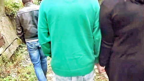 Pamela De Boni walks hand-in-hand with two men outdoors in threesome teaser