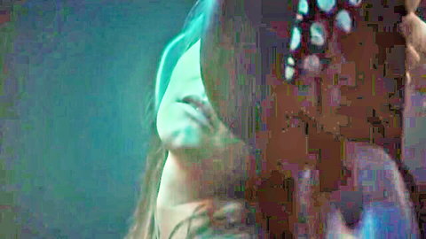 Brunette woman's ecstatic open-mouth face gripped by hand during intense oral sex closeup