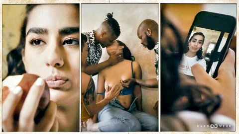 Seductive brunette posing with apple, in interracial threesome with two black men kissing and groping