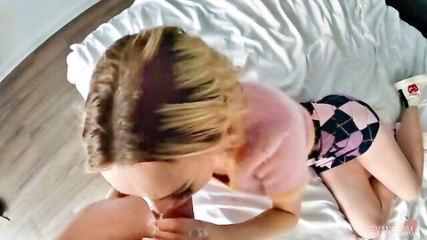 Blonde babe in pink fuzzy top gives sloppy POV blowjob to thick cock on bed