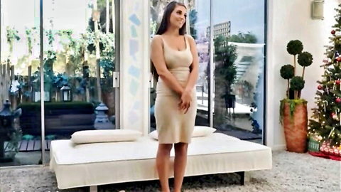 Busty brunette stunner in tight beige dress during casting audition