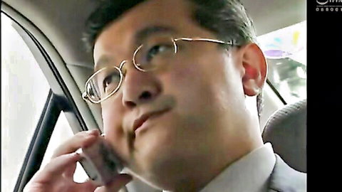 Mature Asian man in glasses on phone call in car, amateur fetish scene