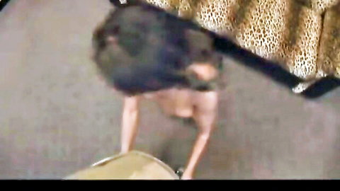 Topless skinny brown brunette with medium hanging tits bends over in leopard pants