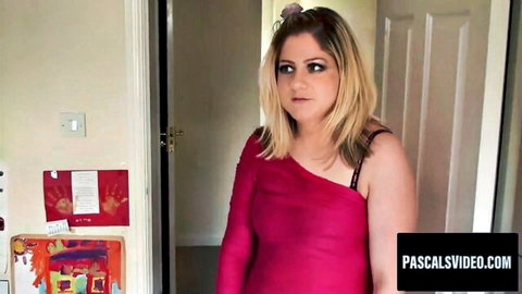 Blonde Leah Lixx in red one-shoulder lingerie stands seductively