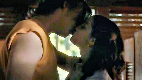 Passionate couple French kissing intensely with open mouths embracing