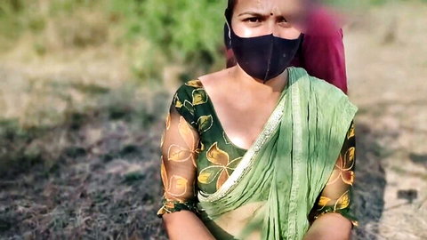 Desi Bhabhi in green embroidered saree and mask posing in jungle vlog