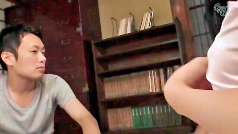 Asian wife in revealing top leaning over husband in intimate JAV scene