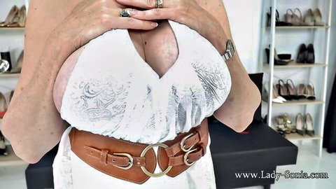 Lady Sonia showing huge cleavage in white lace dress
