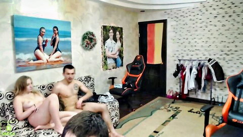 Homemade orgy thumbnail with nude blonde woman and muscular men lounging intimately