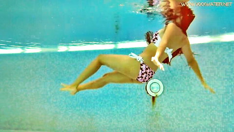 Andreina Deluxe in erotic underwater bikini show, curvy redhead floating nude-like