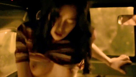 Sarajame8842 topless in car, exposing breasts with intense expression