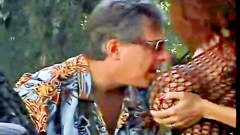 Donita Dunes in passionate outdoor kiss with lover in floral shirt
