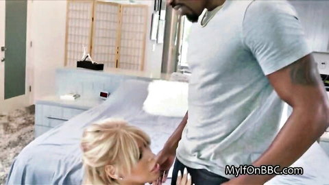 Busty blonde giving blowjob to black stud in casting scene