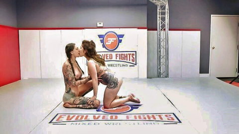 Rocky Emerson and Vanessa Vega topless lesbian kiss in wrestling mat