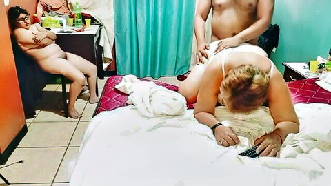 Amateur threesome: reluctant young Latina sucks cock while older blonde MILF watches