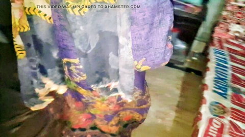Desi woman in colorful saree teases with curves in bathroom