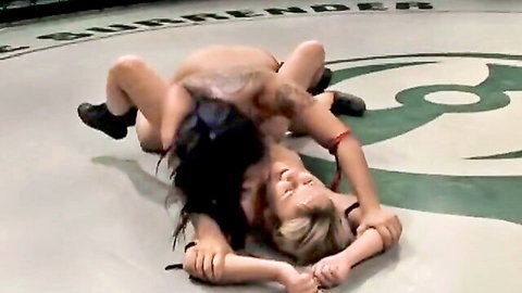 Brunette dominates blonde loser in wrestling, strap-on fuck awaits