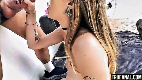 Busty blonde teen Angel Young topless giving blowjob in first anal scene