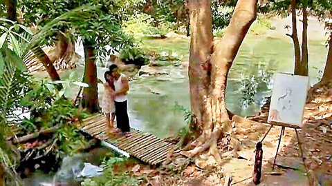 Asian couple embraces on jungle bridge by river, sketch easel nearby