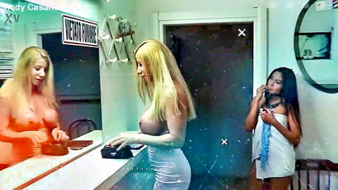 Lara De Santis topless with big tits at vanity, brunette in robe watching