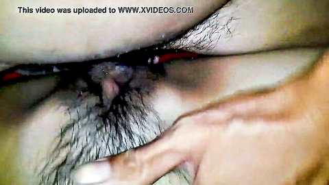 Close-up of Tran Thi May's hairy Asian anus with hand insertion in amateur anal play