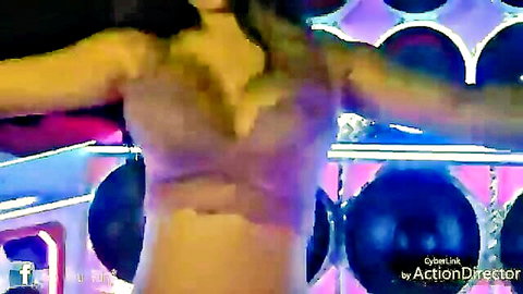 Busty tease in low-cut top dancing seductively
