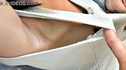 Japanese clerk small tits no bra, erect nipples peeking from pulled sweater side view