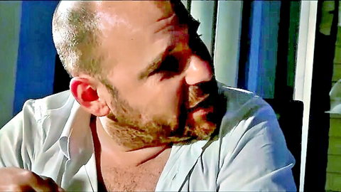 Suzie Q's bearded husband in open white shirt, intimate gaze