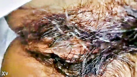 Close-up of Thai woman's ecstatic face during intense oral pleasure