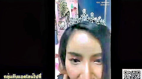 Little Kitty Asian babe with tiara smiling in pink Hello Kitty outfit