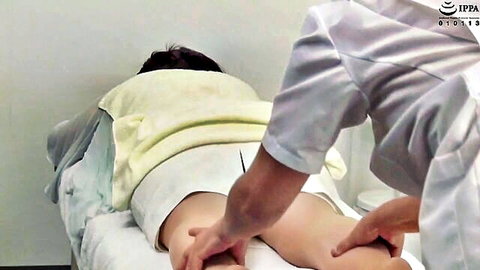 Mature Asian woman getting sensual thigh massage in salon