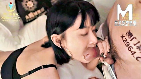 Asian woman in black lingerie performs blowjob on tattooed man