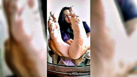 Indian teacher showing stinky bare feet soles close-up