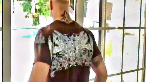 Tattooed muscular man in sheer maroon shirt by the pool, threesome preview
