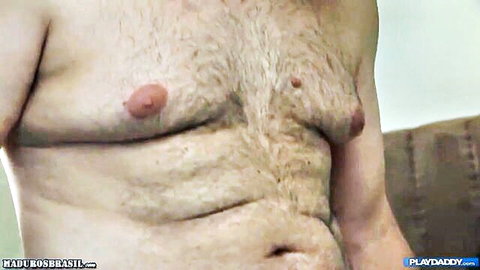 Hairy older man daddy bare chest with prominent nipples closeup