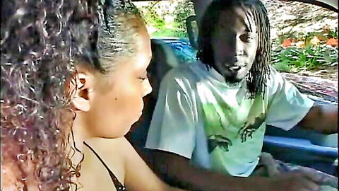 Erika Kane in car with dreadlocked man, curly-haired black beauty in low-cut top