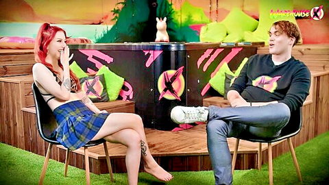 Redhead babe in plaid schoolgirl skirt shocked during interview on colorful Pink Rodeo set with guy