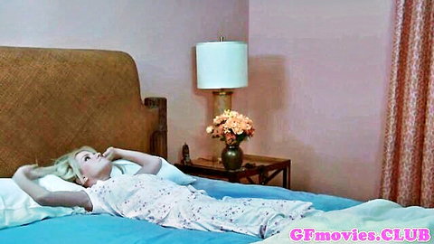 Stunning blonde gf in floral nightgown lounging seductively on bed